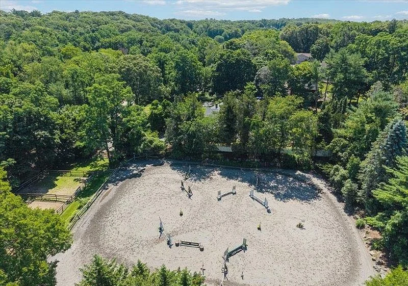 Aerial view of the lighted arena and its full jump course
